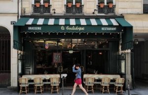 Best Affordable Bistros in Paris (Local Favorites) Classic Paris bistro with terrace tables and green awning