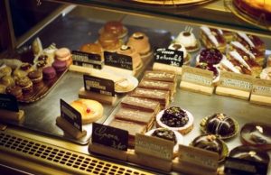 Best Bakeries in Paris by Arrondissement (Map) Assorted French pastries at a Paris patisserie counter with price tags