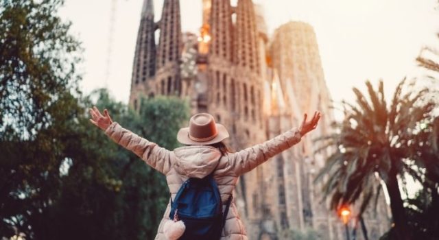 barcelona-2-day-itinerary-sagrada-familia-hero Traveler raising arms at Sagrada Família start of a 2-day Barcelona itinerary