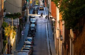 Hidden Barcelona: 20 Quiet Corners Beyond the Crowds Quiet residential street in Barcelona with locals walking dogs at golden hour