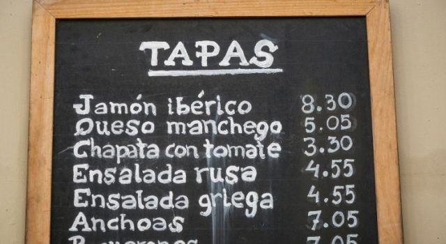 Chalkboard tapas menu outside a bar in Barcelona