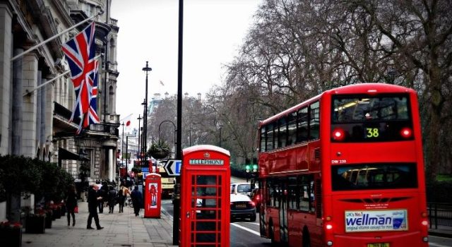 london-48-hours-itinerary-street-scene Classic London street with red double-decker bus, phone box and Union Jack flags