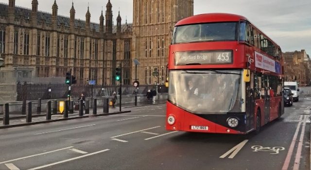 london-free-things-double-decker-bus Red double-decker bus passing the Houses of Parliament in London