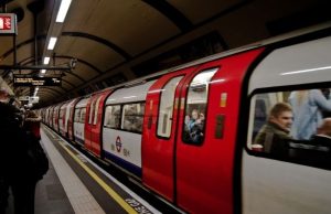 How to Use the London Underground (Tube): A Simple First-Timer Guide London Underground train arriving at a platform with passengers waiting