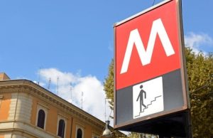 Rome Metro & Buses Explained: Tickets, Passes, and Validation Rome Metro entrance sign with red ‘M’ near historic building