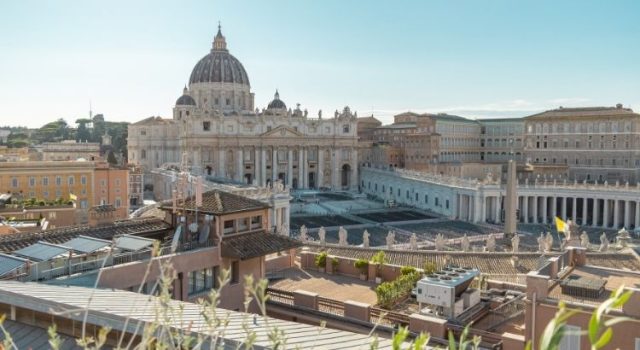 Panoramic view of St. Peter’s Basilica and St. Peter’s Square from a nearby rooftop in Rome