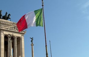 Is the Rome Metro Safe? Pickpockets, Night Tips & Scams to Avoid Italian flag flying in central Rome, symbolizing safety and public life near metro areas