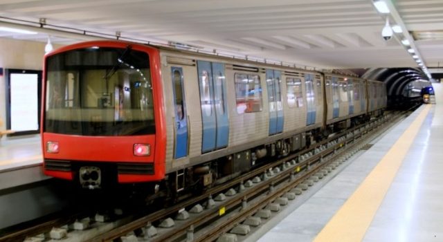 Rome metro train arriving at an underground platform