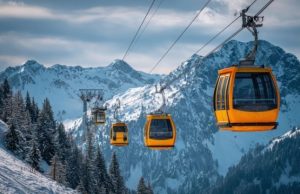 Mont Salève Cable Car Guide: Hiking the “Balcony of Geneva” (2026) Yellow cable cars ascending Mont Salève in winter, offering panoramic views and access to hiking trails known as the Balcony of Geneva.