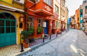 Getting Lost in Balat: Colorful Houses, Steep Hills & Hidden Antiques (2026) Colorful historic houses and cobblestone street in Balat neighborhood, Istanbul