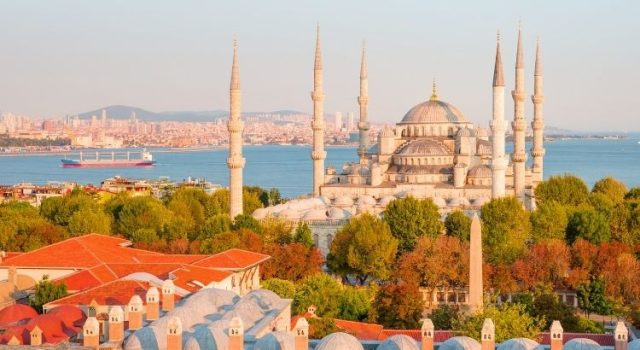 Blue Mosque in Sultanahmet at dawn with Bosphorus view and historic Istanbul skyline