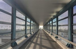 Arriving in Chaos: My Journey from IST Airport to the City Center (2026 Diary) Pedestrian walkway connecting Istanbul Airport metro station to transport lines for city center access