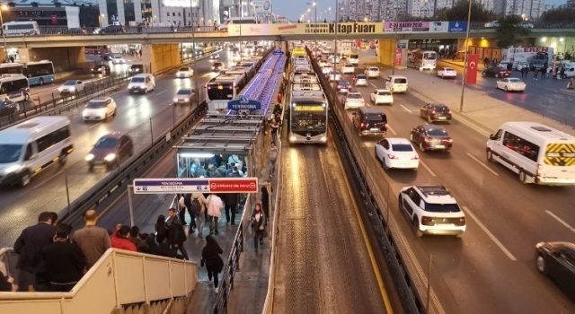 Metrobus station in Istanbul with commuters using public transport system and Istanbulkart access
