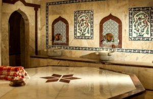 The Hamam Experience: Letting Go of Stress at Kılıç Ali Paşa (2026) Interior of Kılıç Ali Paşa Hamam showing traditional marble göbek taşı, basins, and Ottoman tile details in Istanbul