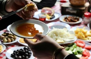 Turkish Breakfast Ritual: Why We Sat at a Table for 4 Hours in Beşiktaş (2026) Traditional Turkish breakfast table in Beşiktaş featuring honey, cheese, olives, tea, and fresh vegetables in Istanbul